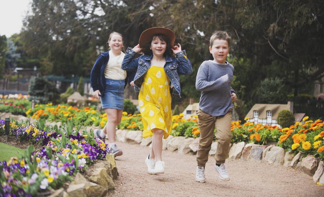 Poppy Cotter McGahey, 10, Evie Anrath, 7, and Noah Anrath, 5, on the hunt for gnomes at the 'Floriade: Reimagined' launch at Cockington Green Gardens on Thursday. Picture: Dion Georgopoulos
