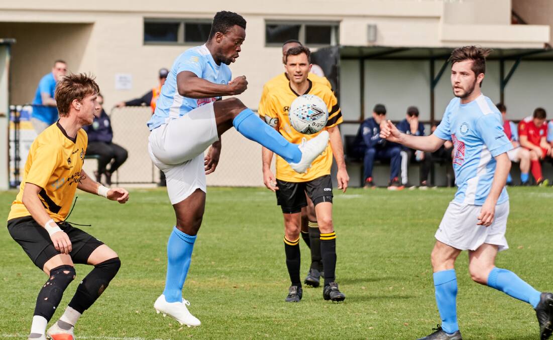 Kofi Danning juggles the ball in Belconnen's loss to Cooma. Picture: Matt Loxton