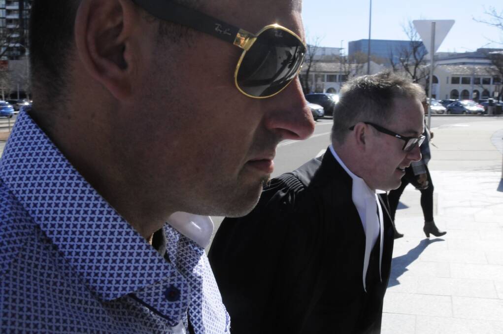 Former bikie boss Peter Zdravkovic, left, arrives at the ACT Supreme Court with barrister Jason Moffett on day one of his trial. Picture: Blake Foden