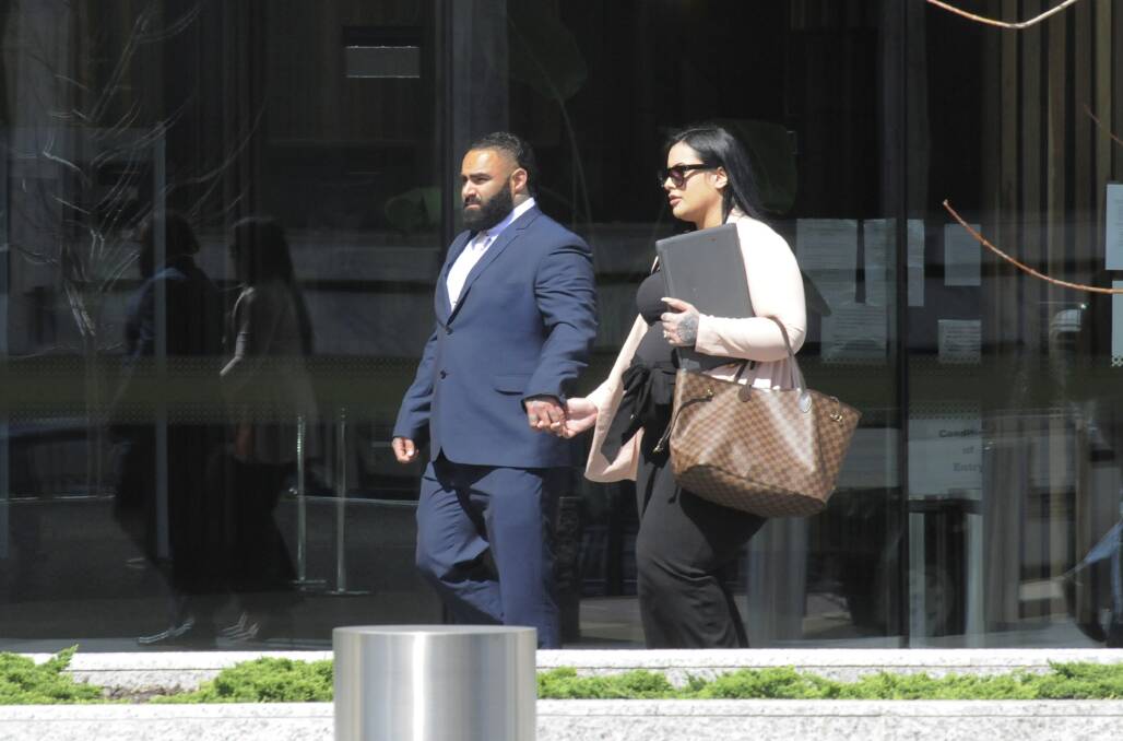 Benjamin James Moarefi outside the ACT courts with his wife, Anna Roufogalis. Picture: Cassandra Morgan