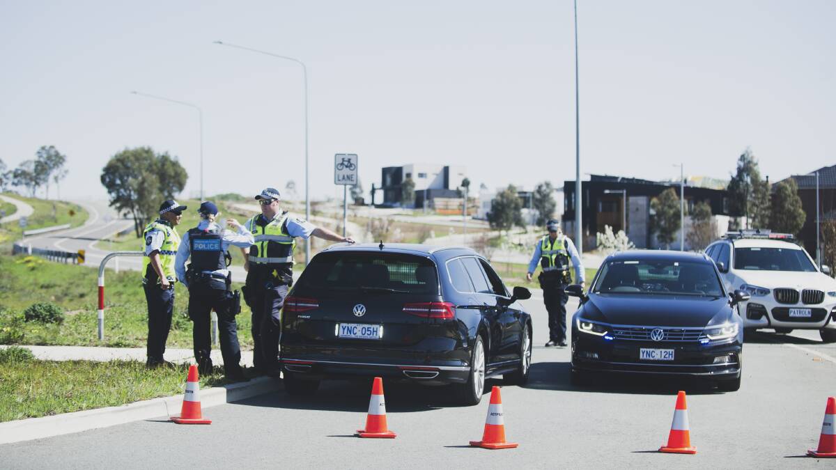 A police blockade is set up at Uriarra Road, Denman Prospect, after a fatal crash on Tuesday. Picture: Dion Georgopoulos
