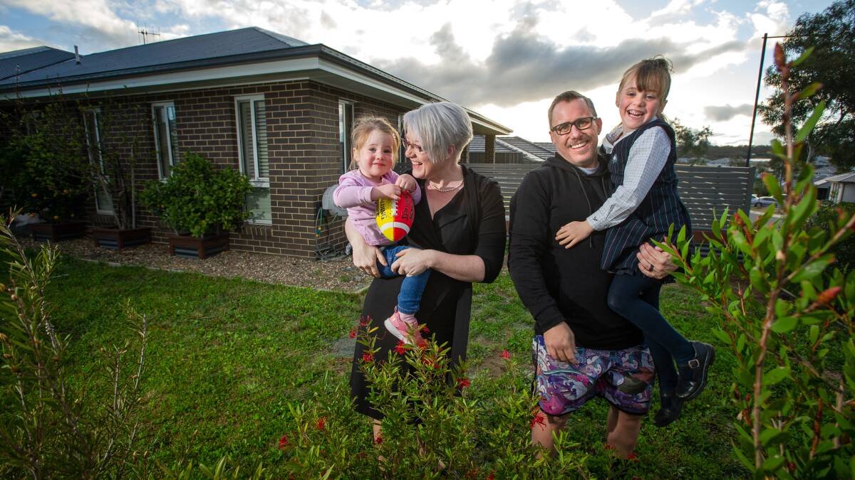 Canberrans Kris and Adam McCoy with their daughters Eleanor, 2, and Charlotte, 5,
moved to Googong six years ago, they said land was more affordable in the NSW suburb. Picture: Elesa Kurtz 