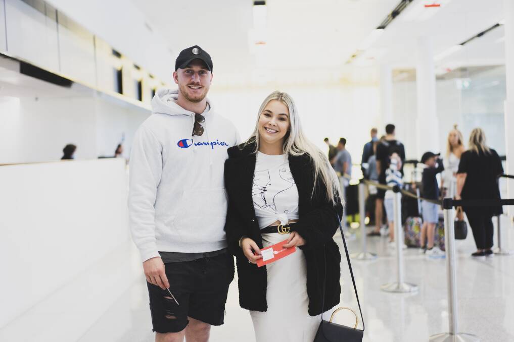Harri Dahl, and Chelsea Mitchell travelling to Queensland after the bordered reopen to ACT on Friday. Picture: Dion Georgopoulos
