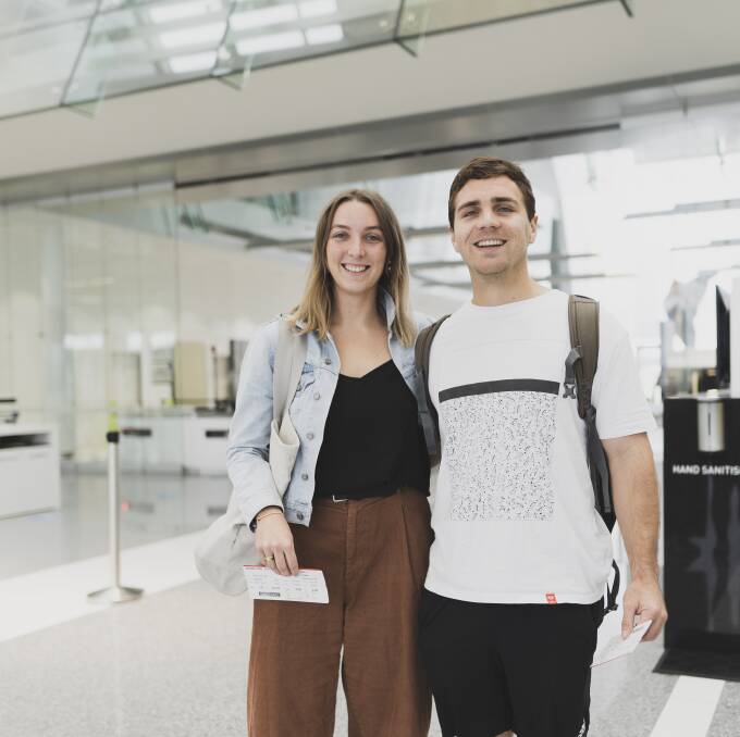 Kate Lowth, and Sam Clarke travelling to Queensland after the bordered reopen to ACT on Friday. Picture: Dion Georgopoulos