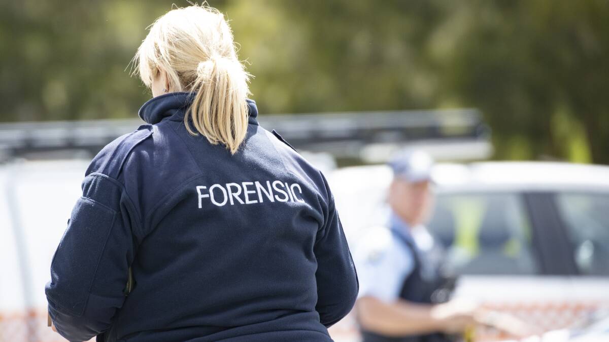 A member of AFP's forensics team at the scene of a fatal stabbing in Weston. Picture: Sitthixay Ditthavong 