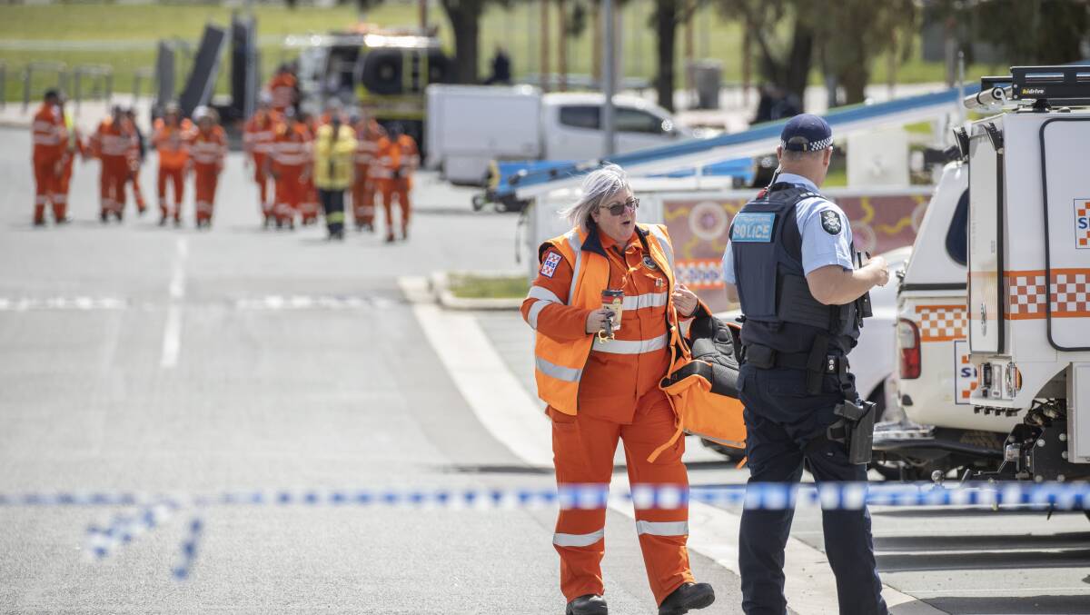 SES volunteers prepare to conduct a line search for evidence after a young man was fatally stabbed at Weston skatepark in the early hours of Sunday morning. Picture: Sitthixay Ditthavong 