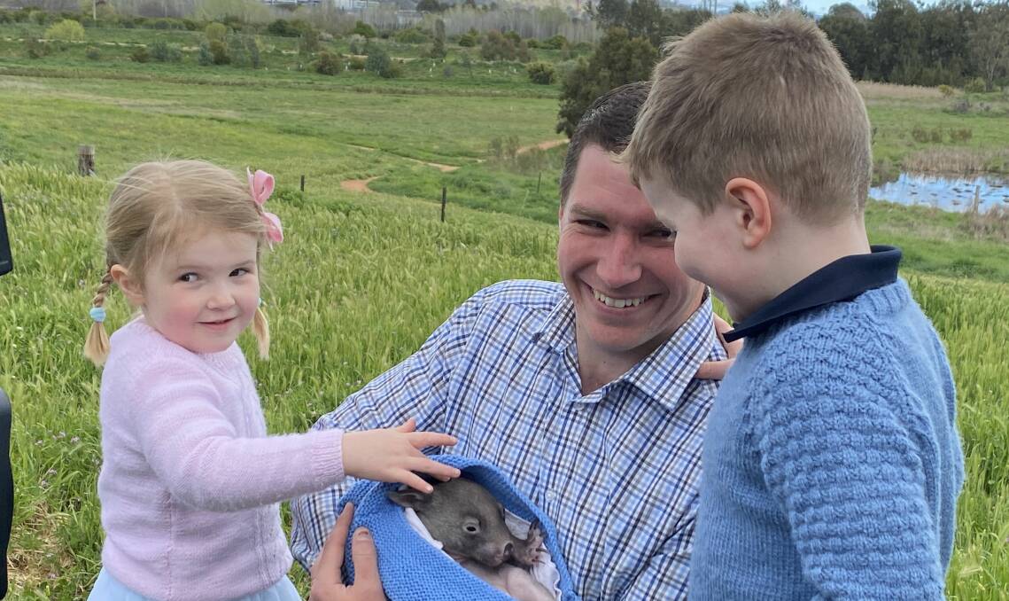 Canberra Liberals leader Alistair Coe with daughter Annabel and son Angus, meeting Brindi the orphaned wombat at the party's environmental policy launch. Picture: Supplied
