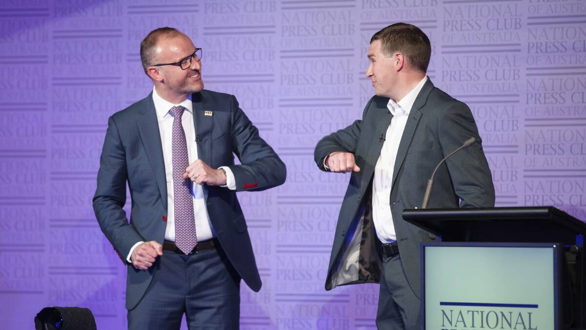ACT Chief Minister Andrew Barr and Opposition Leader Alistair Coe exchange an elbow bump at the conclusion of the ACT leaders' debate. Picture: Sitthixay Ditthavong