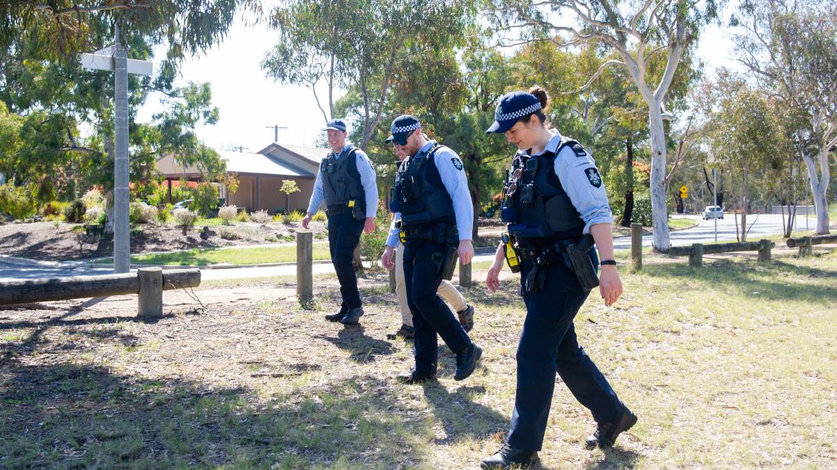 Police scouring the area around the Erindale Scout Hall on Castleton Crescent, Gowrie in October following the alleged stabbing. Picture: Elesa Kurtz