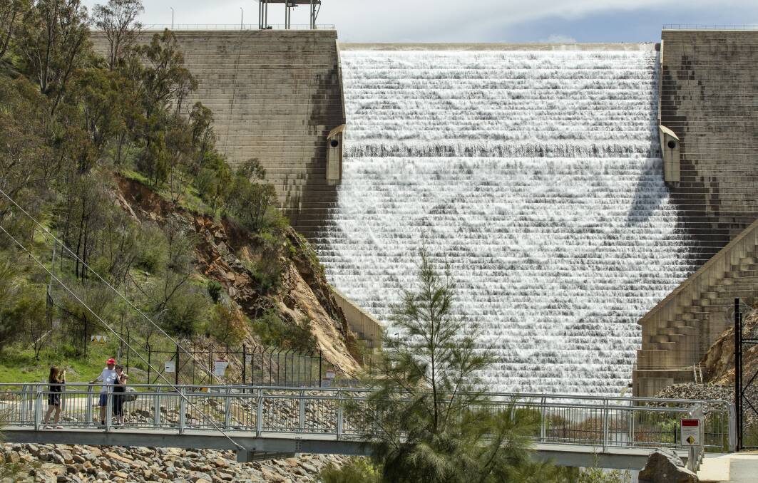 Cotter Dam is overflowing for the first time since 2018. It is likely all Canberra dams will reach capacity by the end of the year. Picture: Sitthixay Ditthavong