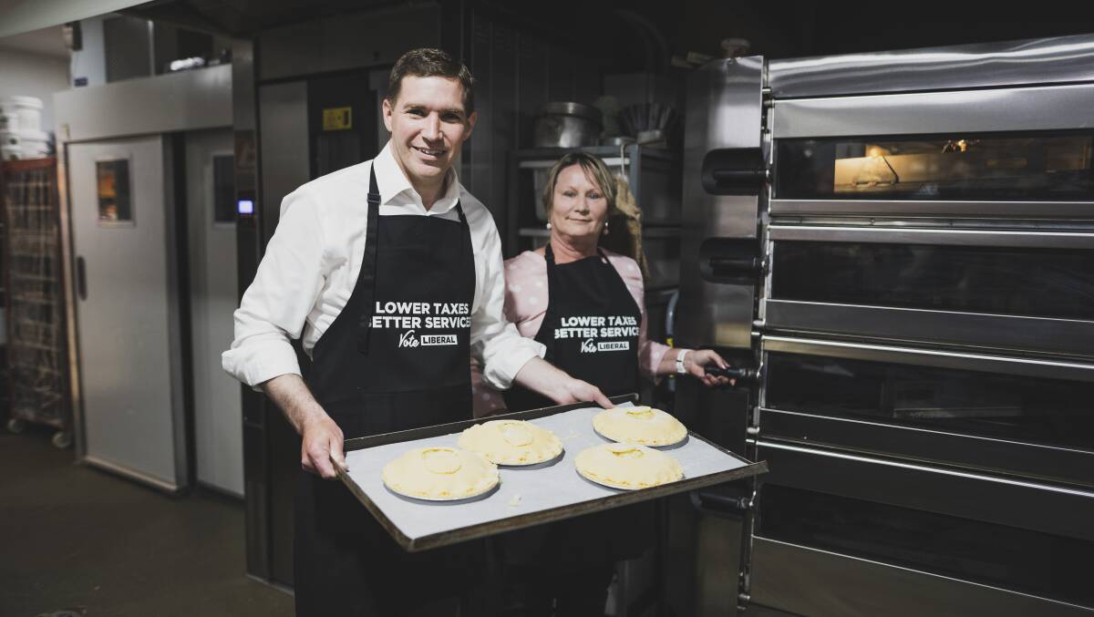It's all about the pie, according to Canberra Liberals leader Alistair Coe and deputy leader Nicole Lawder who announced their economic plan at the Erindale Cakery Bakery. Picture: Dion Georgopoulos