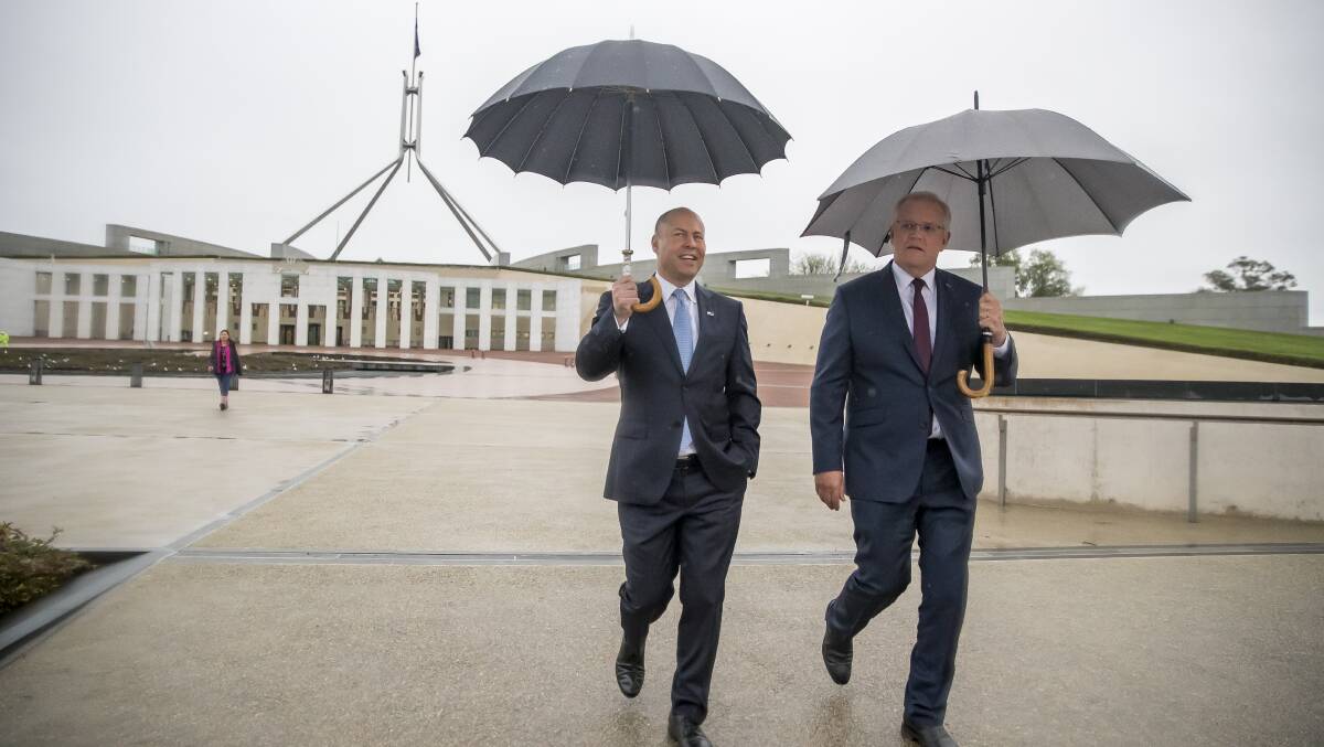 Treasurer Josh Frydenberg and Prime Minister Scott Morrison walk out of Parliament House the morning after handing down the federal budget. Picture: Sitthixay Ditthavong