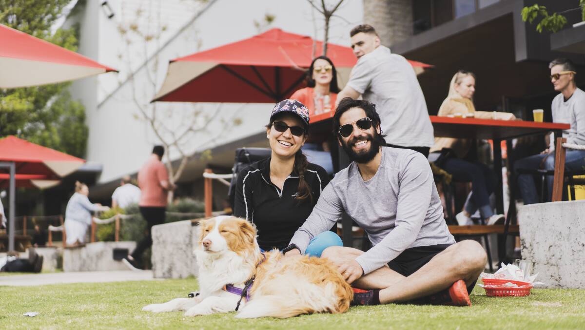 Maria Bidirinis, Roberto Garcia and dog Gyda at Capital Brewing Co welcome eased outdoor dining restrictions. Picture: Dion Georgopoulos