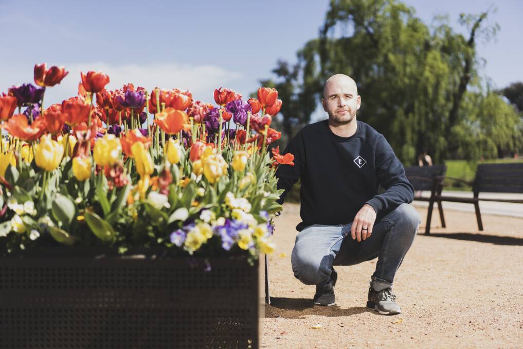 The Pedlar owner Simon Hammond who misses Floriade's usual interstate travellers but says installations around Canberra have been great for the community. Picture: Dion Georgopoulos