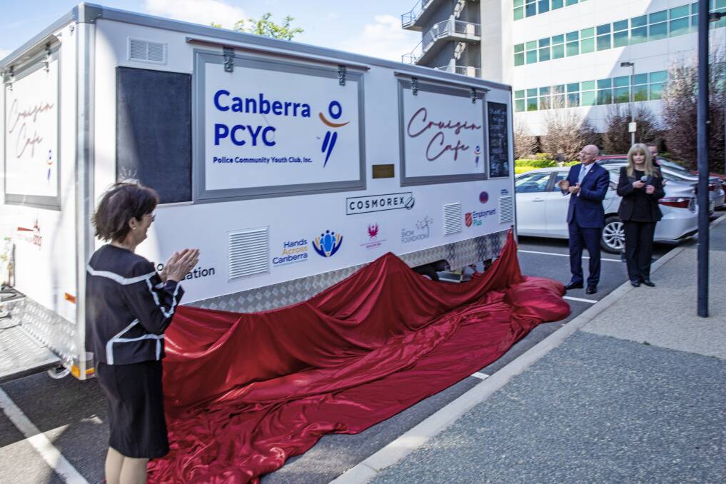 Governor-General David Hurley and his wife Linda Hurley (left) unveil the Cruisin' Cafe for the Canberra PCYC at the Brindabella Business Park on Thursday, with PCYC Canberra CEO Cheryl O'Donnell (right).