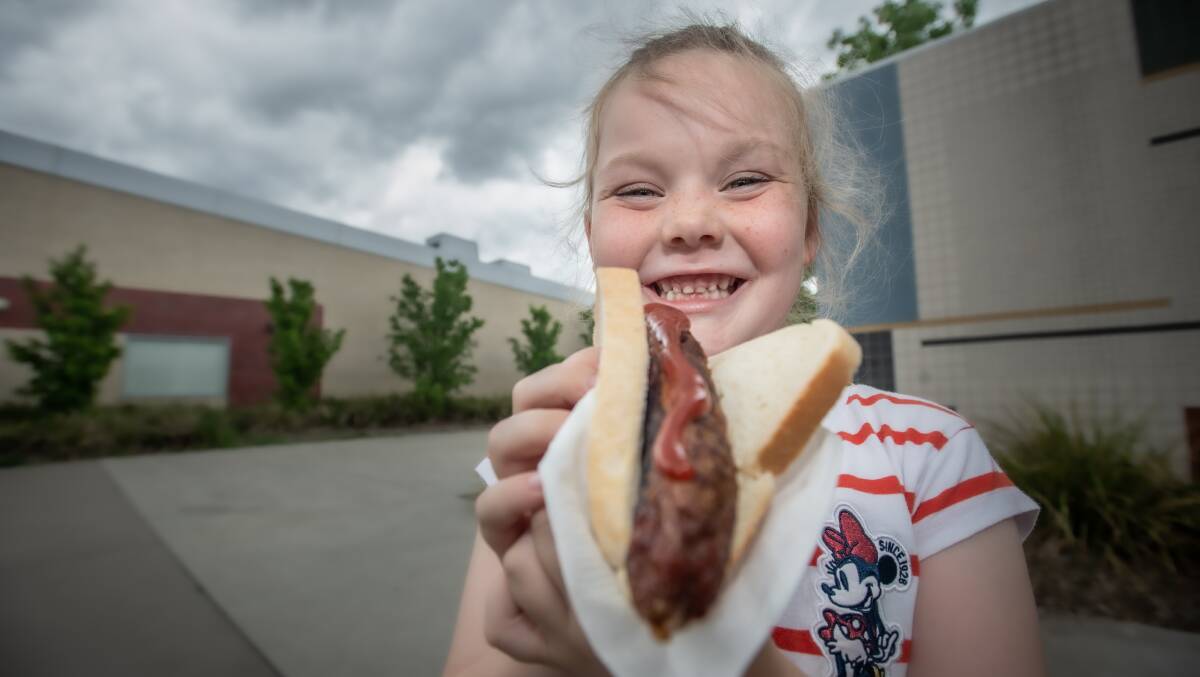 Namadgi school Year 1 student Ashleigh Ellison looks forward to a democracy sausage on election day. Picture: Karleen Minney