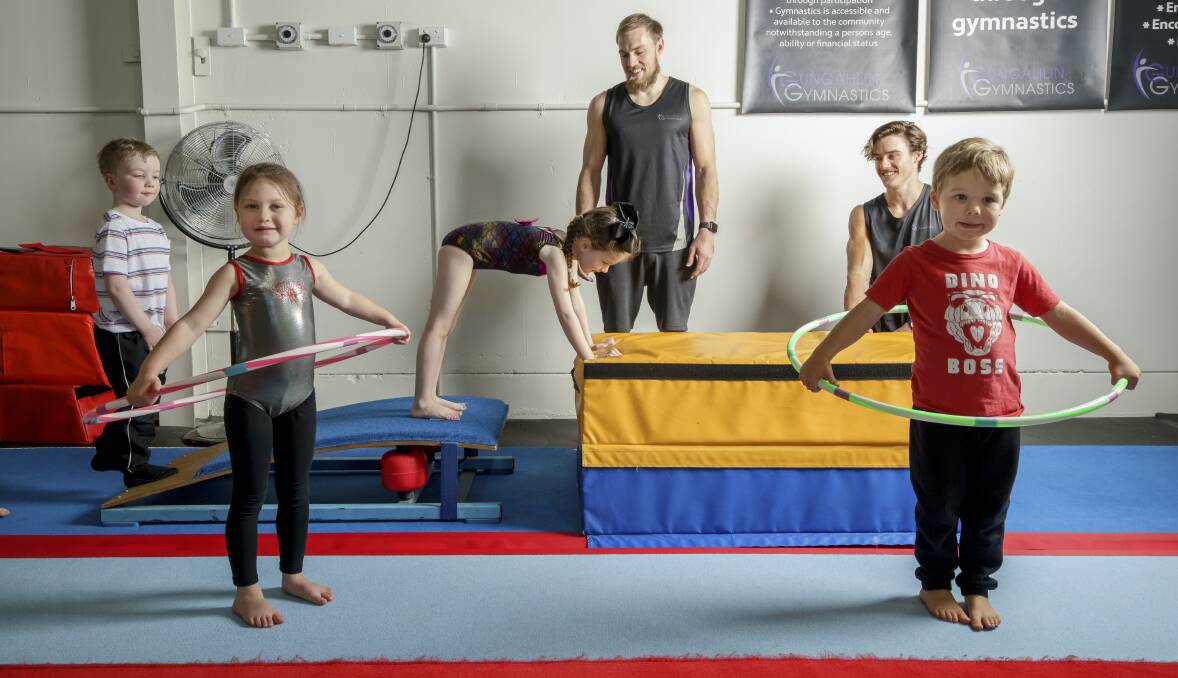 Toyko Olympic hopefuls Mitch Morgans and Tyson Bull pass on some tips to young gymnasts at Gungahlin Gymnastics. Picture: Sitthixay Ditthavong