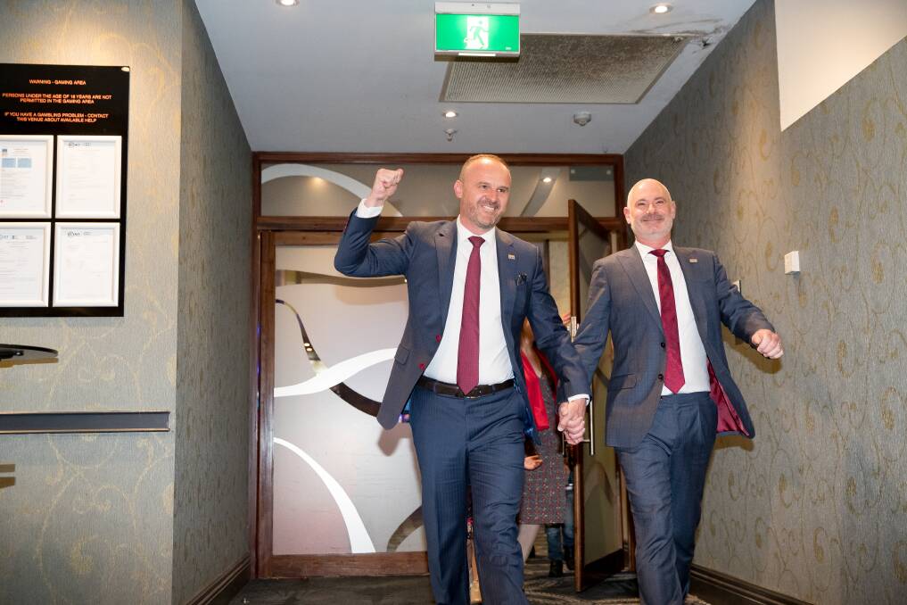 ACT Chief Minister Andrew Barr and husband Anthony arrive at the Canberra Labor Club on election night. Picture: Sitthixay Ditthavong