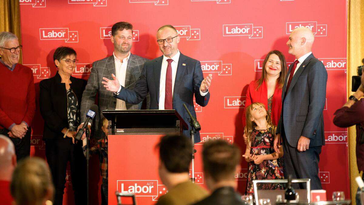 Flanked by his family, ACT Chief Minister delivers his victory speech at the Canberra Labor Club after Labor was returned for a sixth term in the ACT on Saturday. Picture: Sitthixay Ditthavong