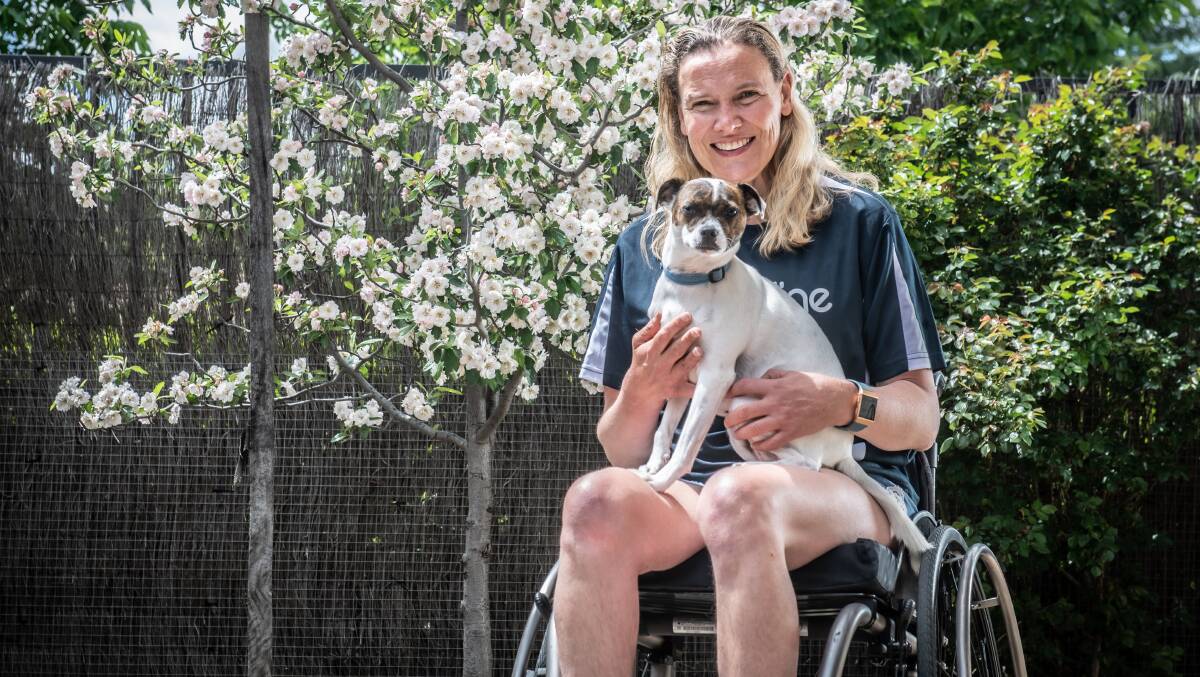 Four-time Paralympian Louise Ellery with her dog Oogi. Picture: Karleen Minney