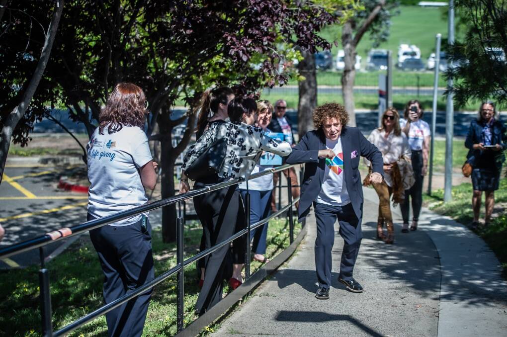 Leo Sayer greets staff and foundation board members as he arrives at the Canberra Hospital. Picture: Karleen Minney