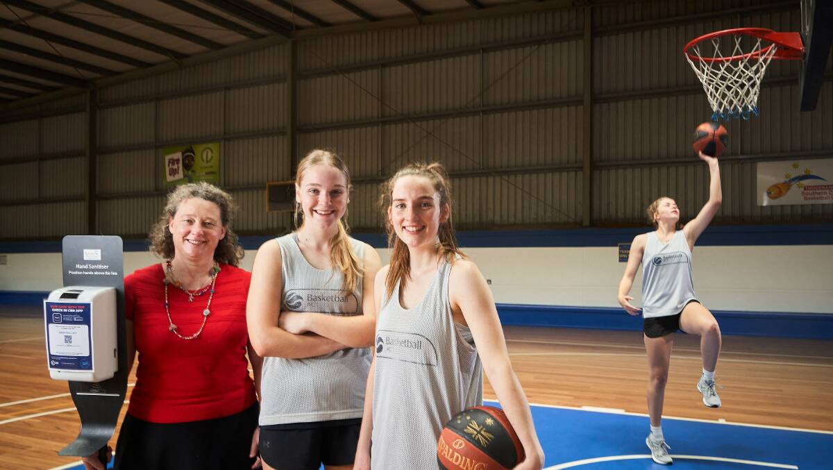 Chief Health Officer Dr Kerryn Coleman with Hayley, 16, Abby, 17, and Maddy Wheatley from the ACT State Team at Belconnen's basketball stadium. Picture: Matt Loxton