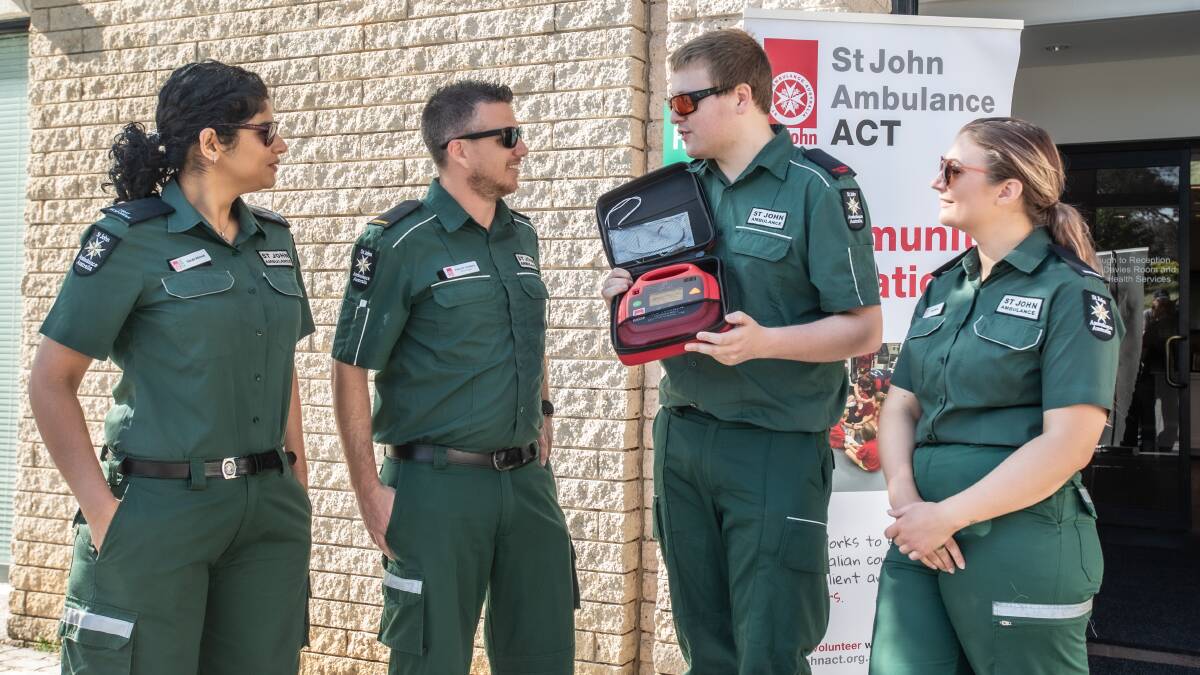 St John Ambulance responders Sarah Ahmad, Phil Thomas, Lachlan Finlayson and Ana Benton look at a defibrillator. Picture: Karleen Minney