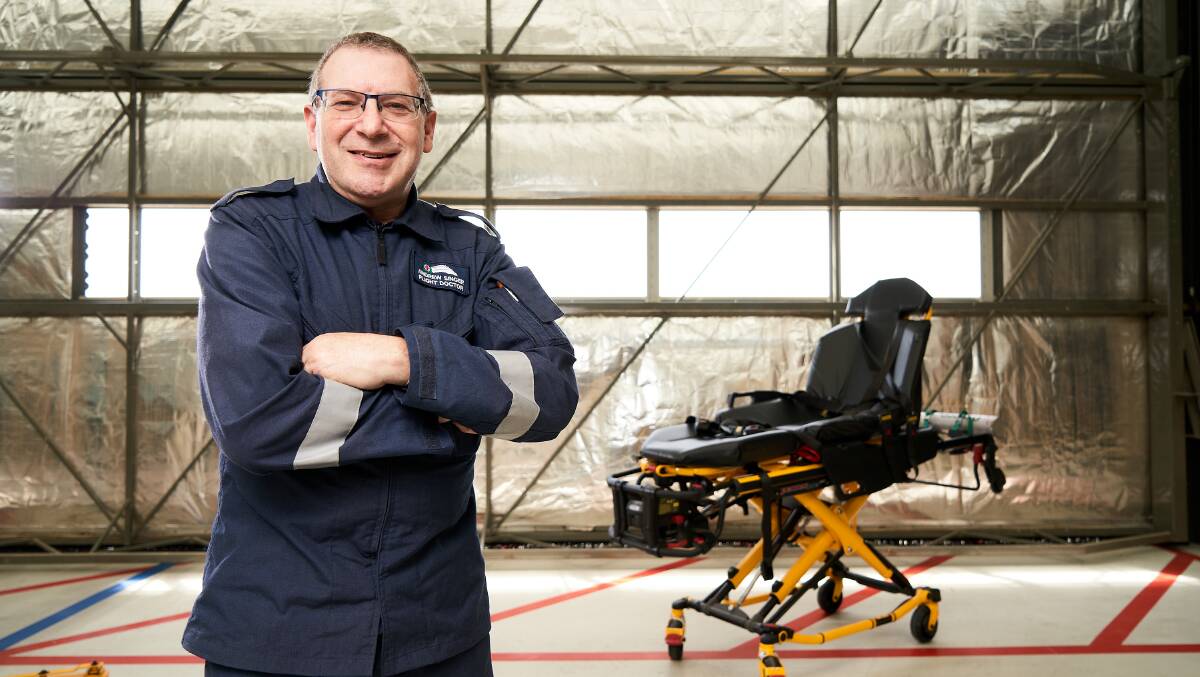 Associate Professor Andrew Singer in the hangar at the rescue helicopter base in Hume just ahead of his final shift last Saturday. Picture: Matt Loxton