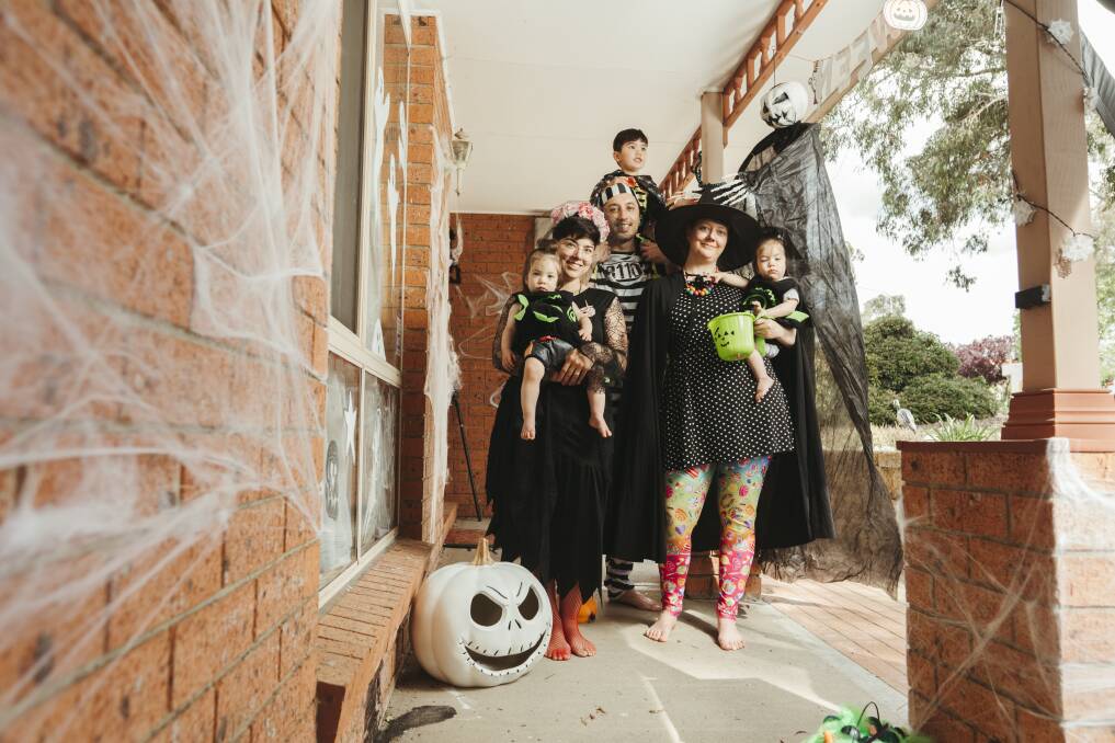Barbara Murotake, Garrett Kelly, and Briony Rollings, with kids Cyla, Hollis, and Poppy Murotake-Rollings are celebrating Halloween at home. Picture: Dion Georgopoulos