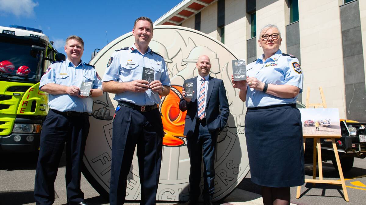 ESA commissioner, Georgeina Whelan, acting chief officer for ACT RFS Rohan Scott, Royal Australian Mint general manager Mark Cartwright and ACT Fire and Rescue commander, Glenn Brewer at the launch of new circulating coin to commemorate firefighters. Picture: Elesa Kurtz 