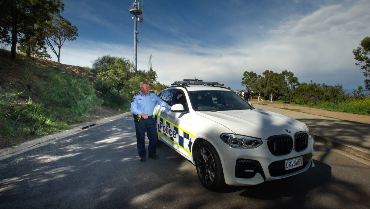 The officer in charge of road policing, Detective Inspector Marcus Boorman, with one of the force's new BMW X3 police cars. Picture: Karleen Minney.