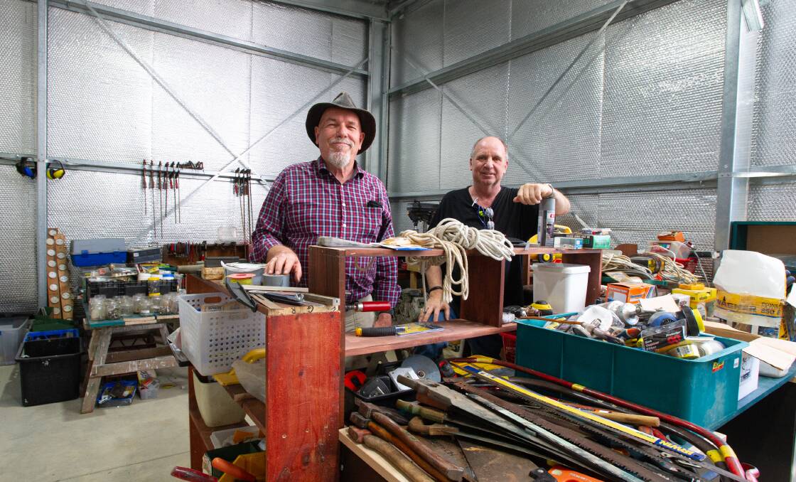Hughes Community Shed with steering committee members Bill Barker and Peter Bourke with a portion of the many tools that have been donated. Picture: Elesa Kurtz
