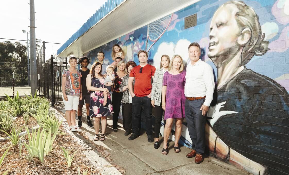 Robyn Page, Utkarsh Akhouri, David Perfrement, Nicole, David, Sonny, 1, Aisha, 4, Striegl, Julie, Lorna, Matt, Hayley, Susie, and Jim Rapson at the Kippax Tennis Club where a mural is painted for Corey Rapson who died in a car crash in Melbourne two years ago. Picture: Dion Georgopoulos