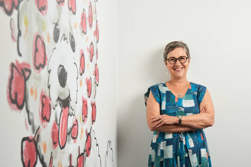 Cathy Wilcox in Canberra on Friday with "coronapuppy" her artwork to fit the theme of this year's Behind the Lines exhibition - 2020: a dog's breakfast. Picture: Matt Loxton