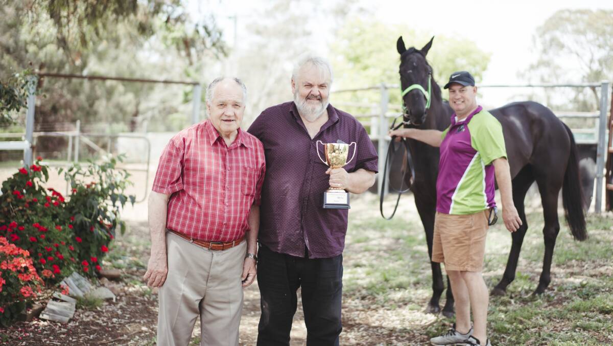 The Queanbeyan racing community, including Frank Cleary, Queanbeyan CEO Brendan Comyn and Joe Cleary will honour Darren Bailey at Sunday's Queanbeyan Cup. Picture: Dion Georgopoulos