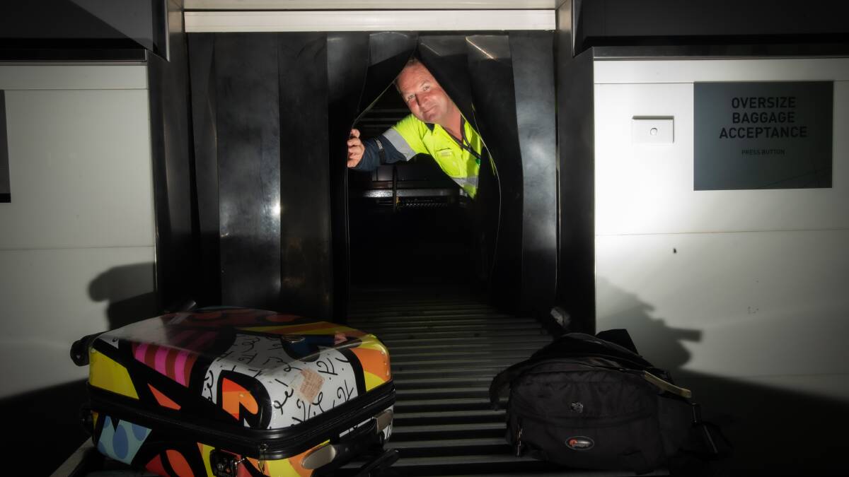 Canberra airport Airline service officer Chris Carney has had to re-apply for his luggage handling job after 17 years with Qantas. Picture: Karleen Minney