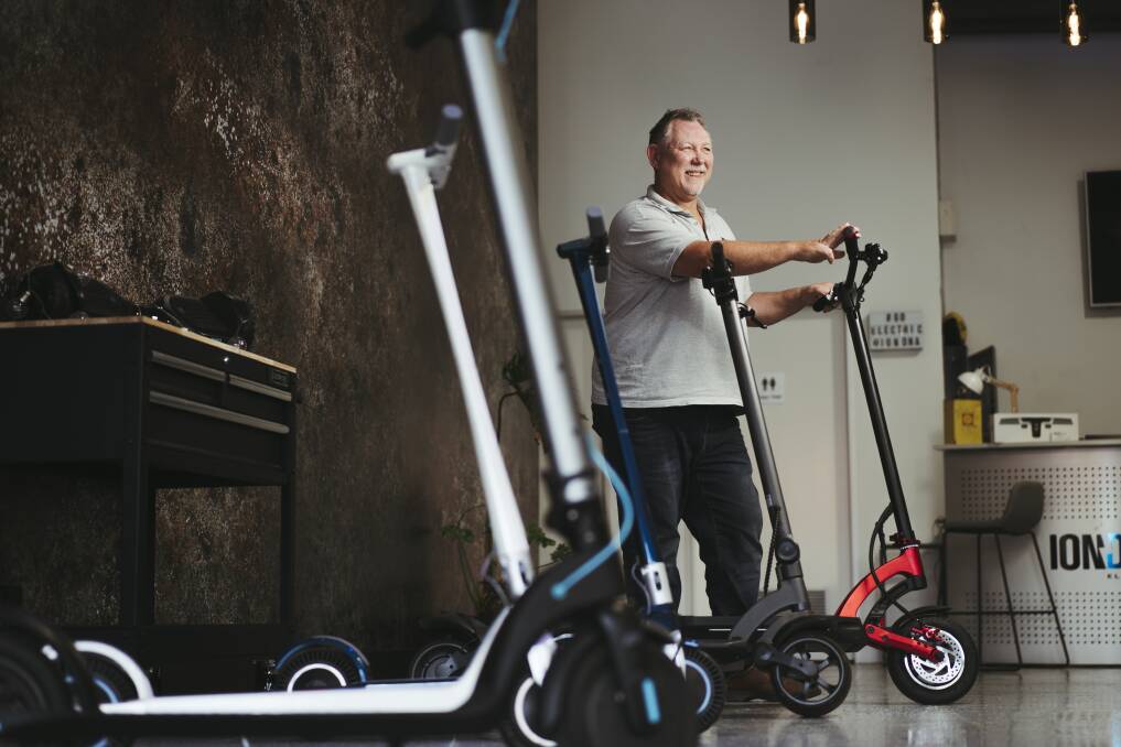 ION DNA owner Rob Ogilvie at his store in Fyshwick with a selection of their electric scooters. Picture: Dion Georgopoulos 
