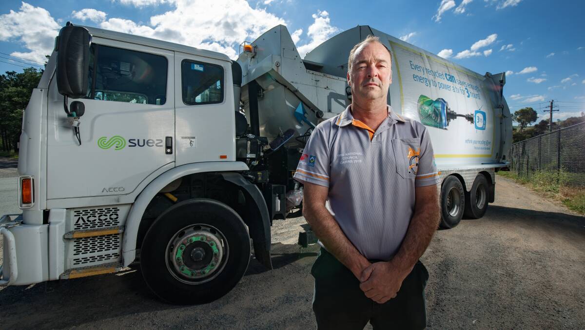 Transport Workers Union branch secretary Klaus Pinkas with a Suez garbage truck on Wednesday. Picture: Sitthixay Ditthavong.