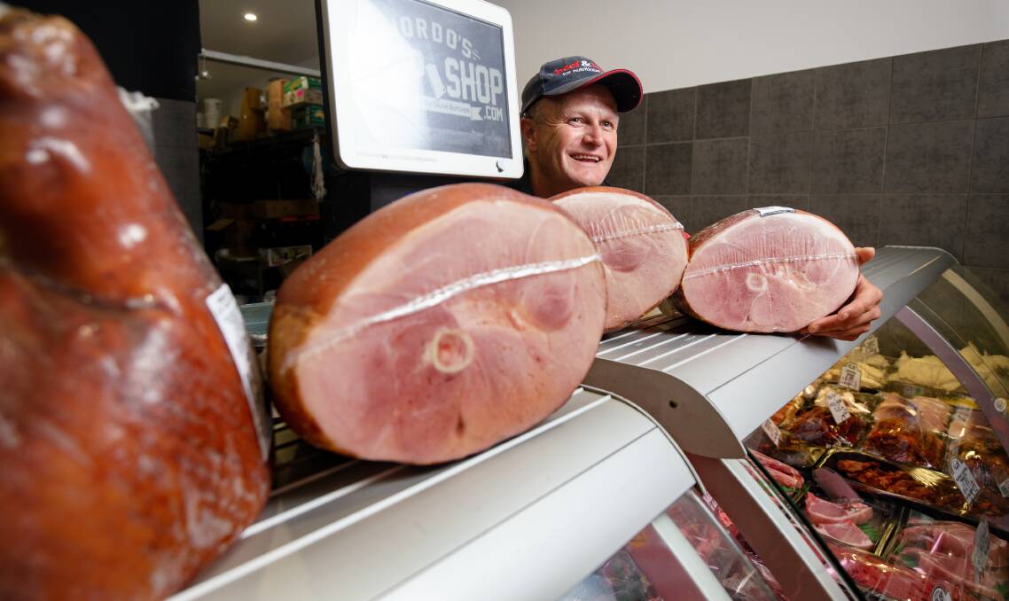 Jordo's Chop Shop's Aaron Fenning recommends shoppers get their Christmas ham orders in early as there is a shortage of pork products across the board. Picture: Sitthixay Ditthavong