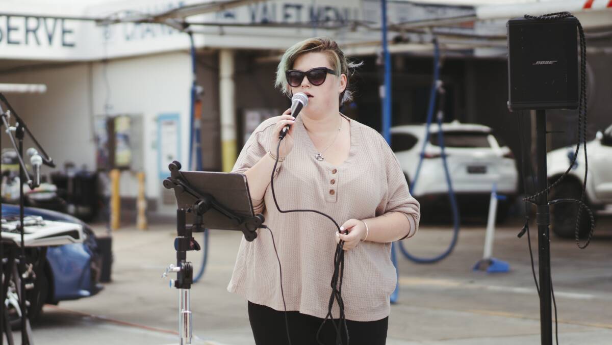 Musician Louise Cooke performing in the final of the Braddon Busking Festival outside Waves Car Wash. Picture: Dion Georgopoulos