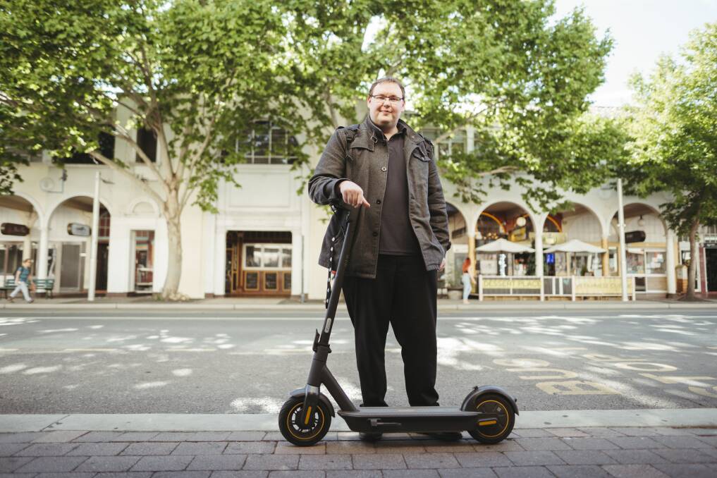 Chris Allum with his electric scooter at the Civic bus interchange. Picture: Dion Georgopoulos 