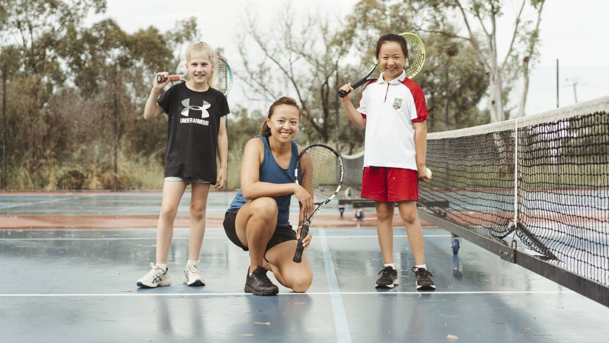Alison Bai and her tennis students, Ashley Ward 9, and Emily Zhang 9 at Radford College. Picture: Dion Georgopoulos