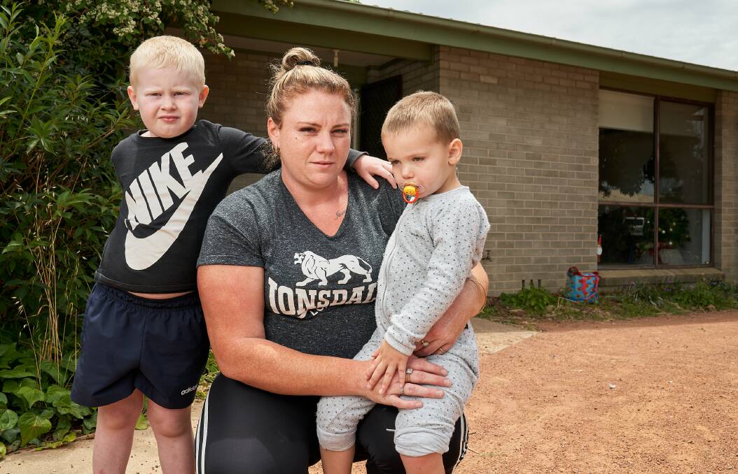 Mother of five Aleece Robinson, with Levi, 4, and Cody, 2, at what was meant to be just a temporary home in Kaleen. Picture: Matt Loxton