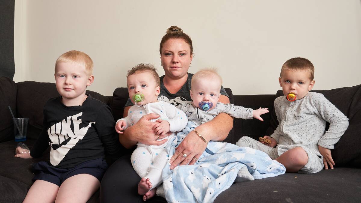 Ms Robinson, with Levi, 4, twins Jake and Kaiden, 6 months and Cody, 2, at home in Kaleen. Picture: Matt Loxton