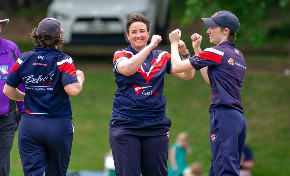 Eastlake bowler, Fleta Page, celebrates with teammates after dismissing Ginninderra's Perri Nash. Picture: Elesa Kurtz