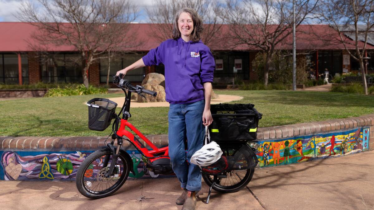 The Canberra Electric Bike Library is set to expand. SEE-Change Executive Officer Brook Clinton rides a compact e-cargo bike. Picture by Sitthixay Ditthavong