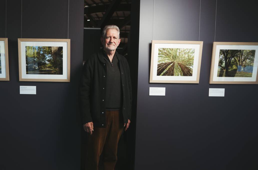 Photographer Graham Gall with his pieces on show at the National Arboretum. Picture: Dion Georgopoulos