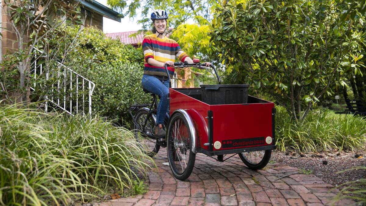 Brook Clinton and her Capital Scraps colleagues cycle the streets of Canberra in the mornings collecting food scraps from households to turn into compost. Picture: Keegan Carroll