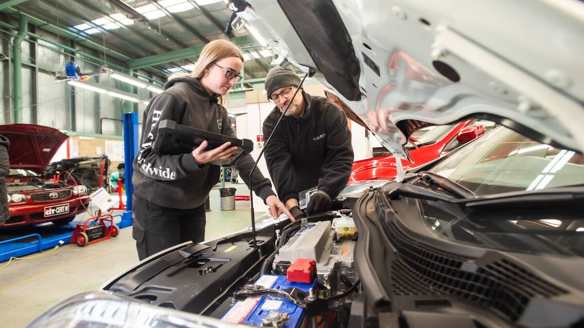 Second year CIT apprentice mechanics Emily Thornton and Mathew Lovich taking part in a specialist course in how to fix Electronic Vehicles, which is set to be a growing field of mechanics. Picture: Karleen Minney