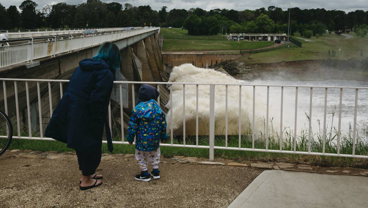 Vicitors check out Scrivener Dam after heavy rainfall during the week. Picture: Dion Georgopoulos